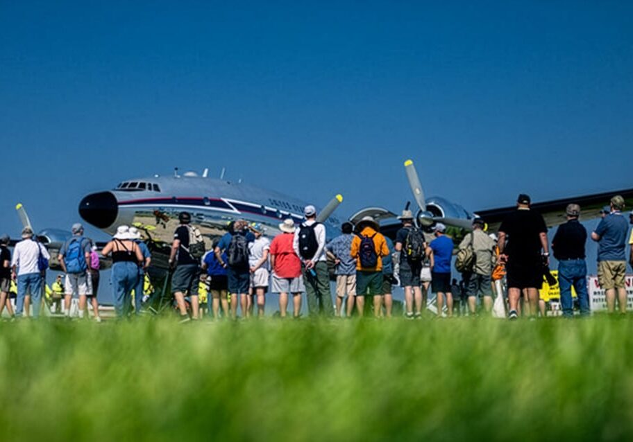 A crowd gathered at EAA to look at an airplane.